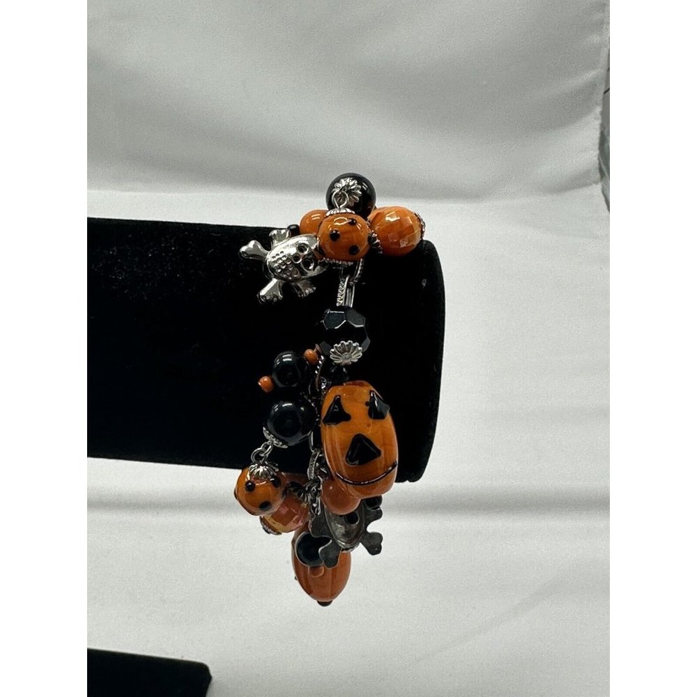 halloween bracelet with whimsy skulls, pumpkins, orange beads, black polka dots